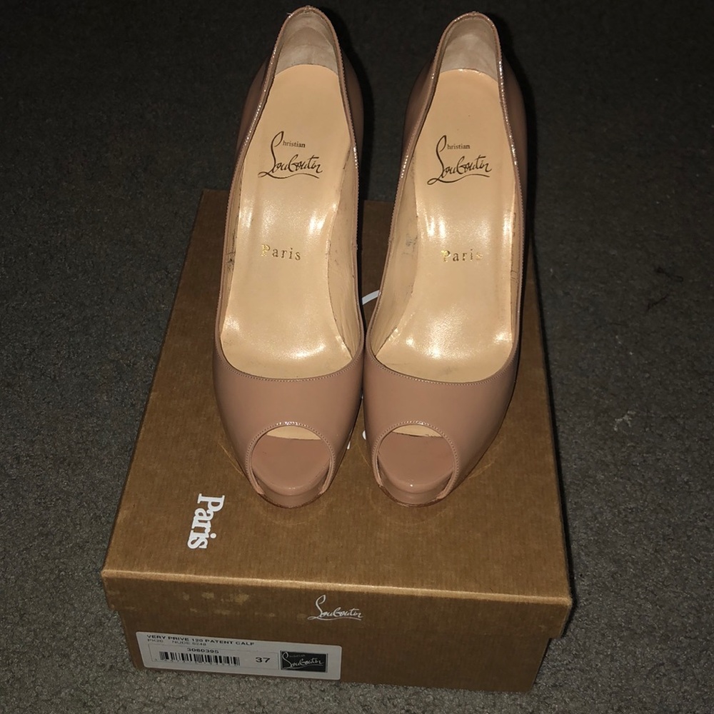 Christian Louboutins nude  peep toe heels.